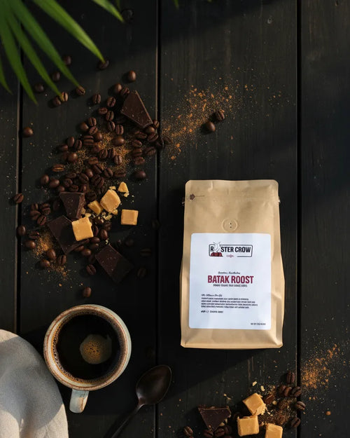 Batak Roost Sumatra single-origin coffee from Rooster Crow Coffee, flat lay photo showcasing a 12oz bag with bold, earthy medium-dark roast flavor notes