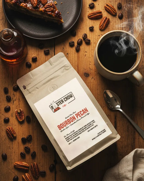Bourbon Pecan flavored coffee from Rooster Crow Coffee, 12oz bag surrounded by flavor notes highlighting rich bourbon and roasted pecan profile